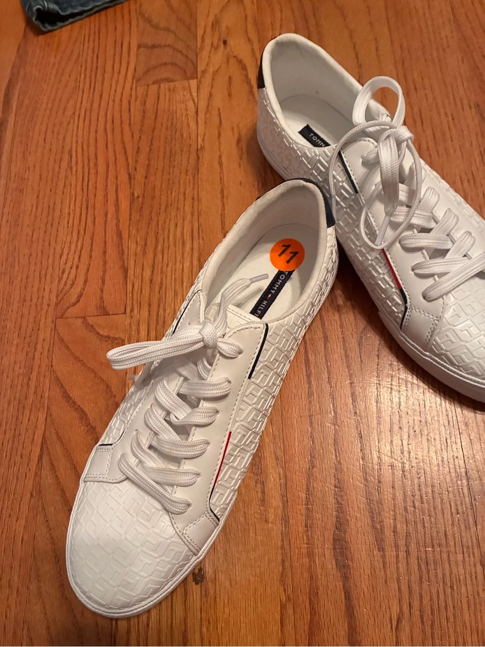 Tommy Hilfiger White Embossed Sneakers with Navy Heel and Red-White-Blue Stripe.